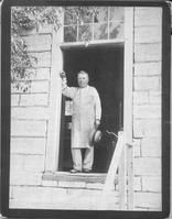 SA1427 - Photo of a man in the doorway of the tin shop. Photo is associated with the Center Family. Identified on the back.